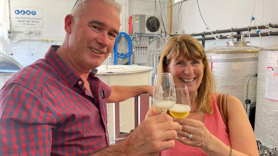 Couple enjoying a beer tasting at Abandoned Brewery in Wellington