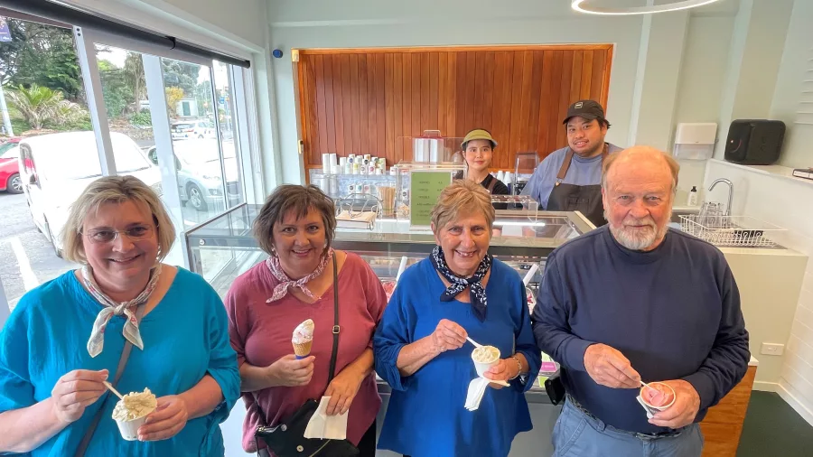Group of customers smiling with cups and cones of gelato inside Lamoon Gelato in Kāpiti