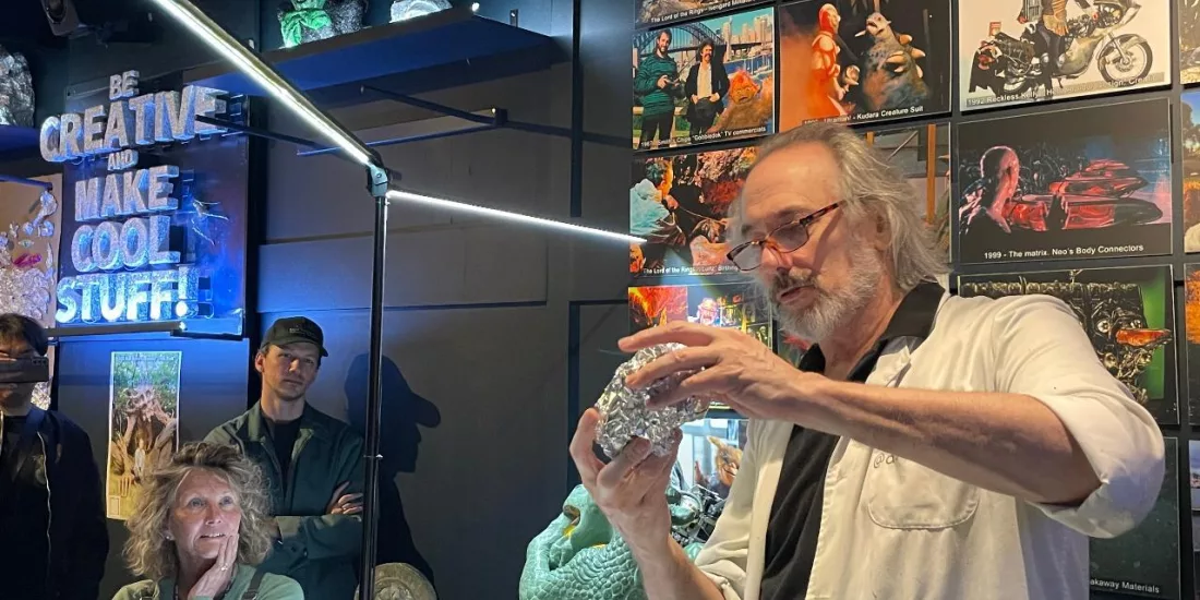 Wētā Workshop artist demonstrating sculpting techniques to visitors