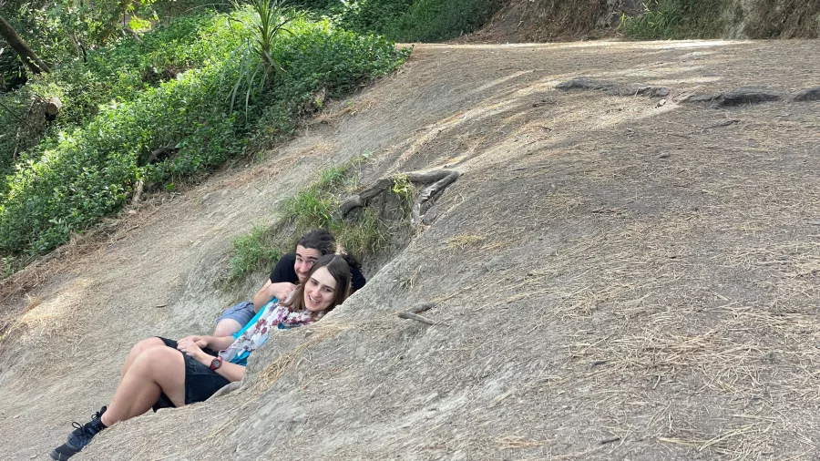 Two visitors lying in the exact hollow where the Hobbits hid from the Nazgûl in Lord of the Rings