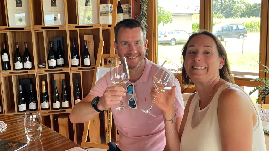 Couple enjoying a wine tasting at Johner Estate’s cellar door in Gladstone, Wairarapa