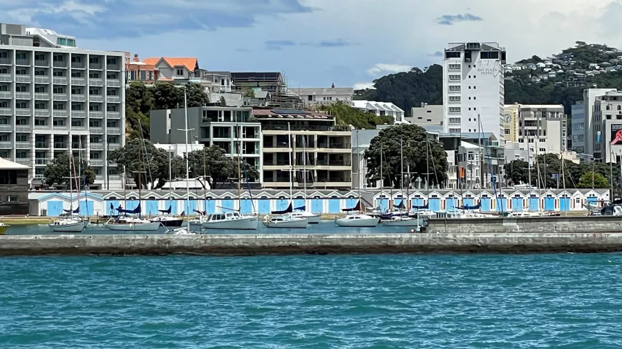 View of colourful Wellington boatsheds and moored boats along the harbour