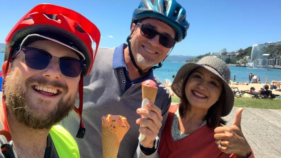 Group enjoying ice cream by the Wellington waterfront on a sunny day