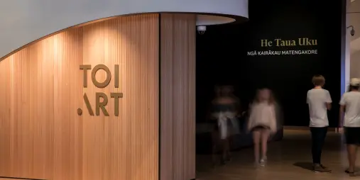 Guests engaging with contemporary New Zealand art during a guided Toi Art experience at Te Papa