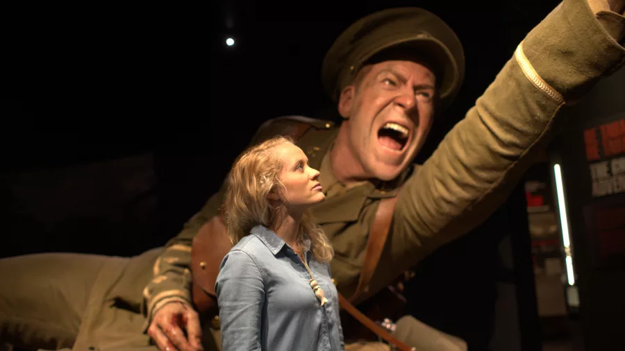Visitor observing a giant soldier sculpture at the Gallipoli exhibition in Te Papa museum, Wellington.