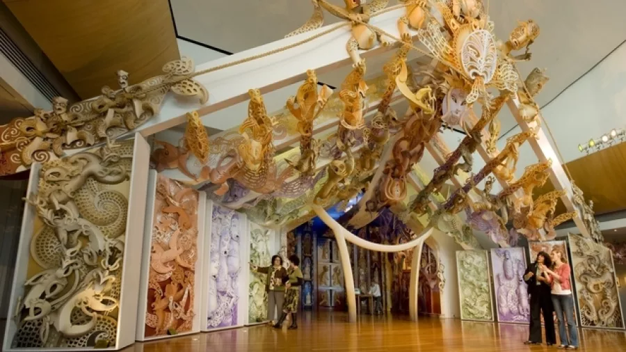 Visitors exploring Rongomaraeroa, Te Papa’s contemporary marae that showcases modern Māori artistry