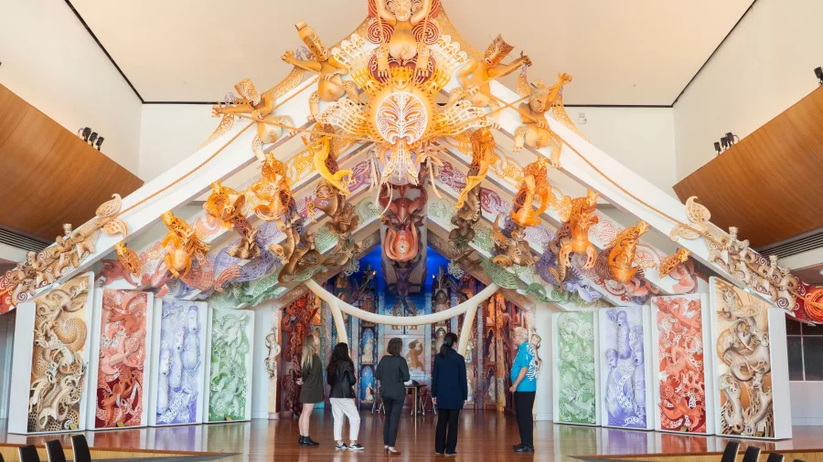 Visitors stand in front of Rongomaraeroa, the contemporary marae at Te Papa Museum in Wellington