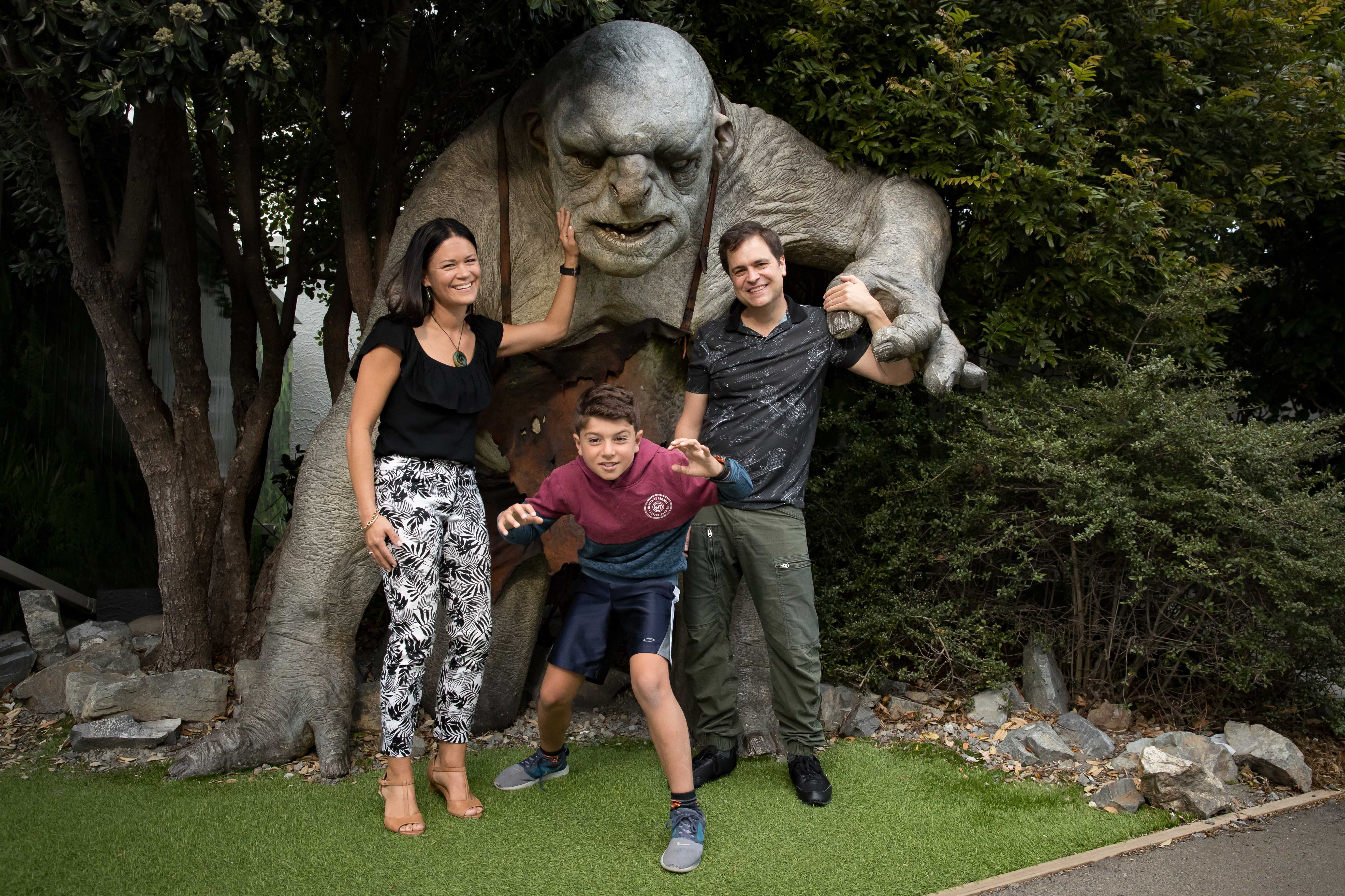 People standing in front of a Troll Sculpture at Weta Workshop: Credit Weta Workshop
