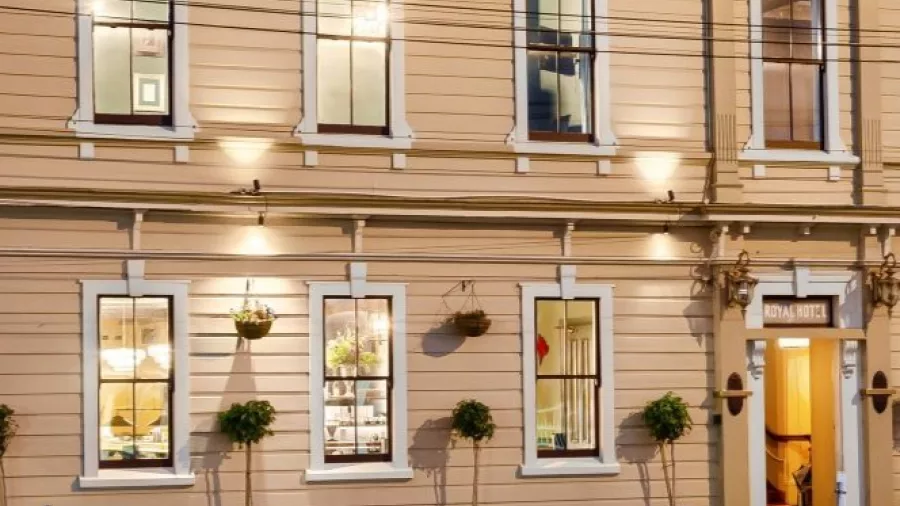 Exterior of The Royal Hotel in Martinborough at twilight with warm lighting