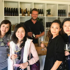 Group of travellers enjoying wine tasting during a Martinborough Foodie Tour