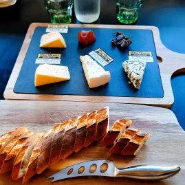 Artisan cheese platter with sliced bread served during the Martinborough Foodie Tour