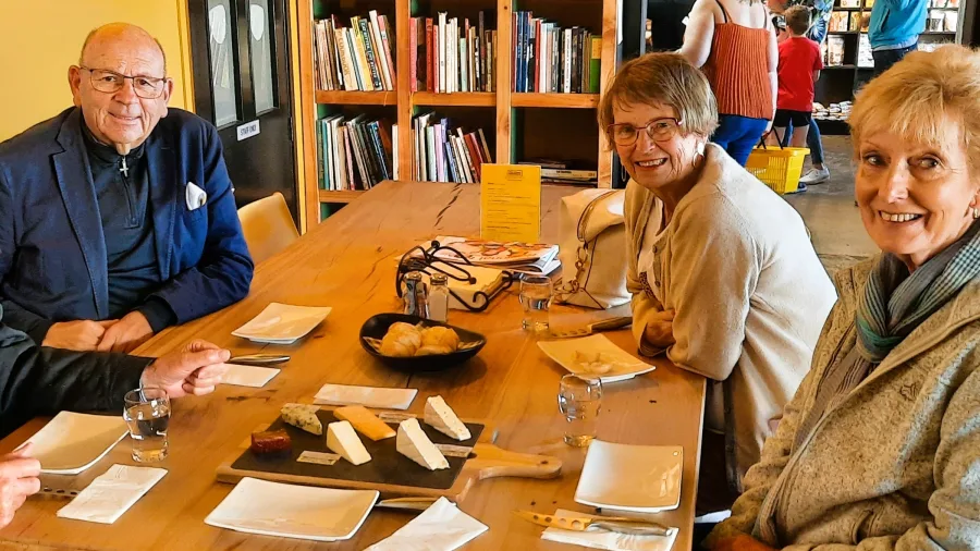 Group enjoying a cheese tasting session during the Martinborough Foodie Tour