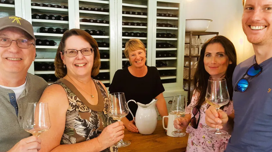 Travellers enjoying a wine tasting experience during the Martinborough Foodie Tour