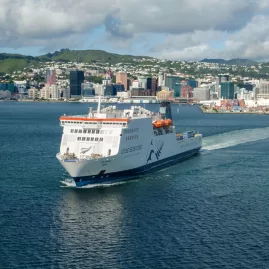 Interislander ferry departing Wellington Harbour with cityscape in the background