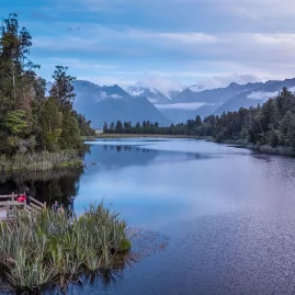 Reflection Island at Lake Matheson near Fox Glacier with Southern Alps reflected on the water