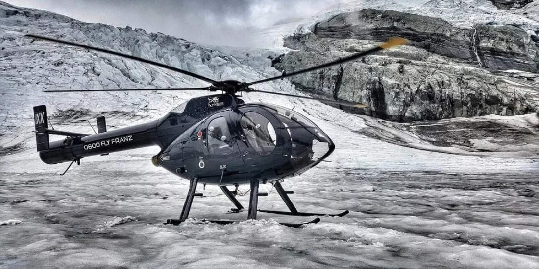 Helicopter parked on glacier during Mt Cook Supreme tour with Glacier Country Helicopters
