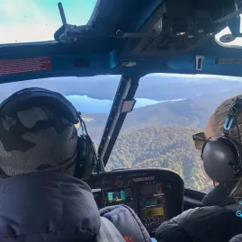Passengers flying over Lake Mapourika with Glacier Country Helicopters near Franz Josef