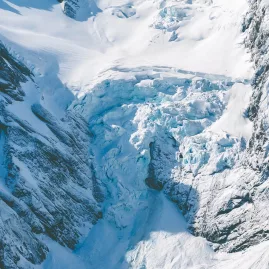 Aerial view of deep crevasses and icefalls on Franz Josef Glacier