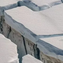 Close-up view of glacier crevasses near Franz Josef from a helicopter tour departing Greymouth