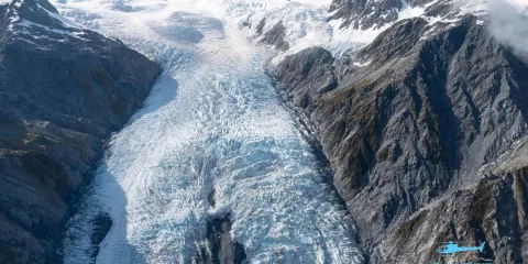 Aerial view of Franz Josef Glacier framed by rugged mountains