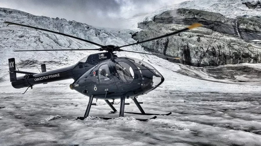Helicopter parked on glacier during Mt Cook Supreme tour with Glacier Country Helicopters