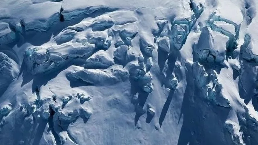 Aerial view of deep ice crevasses on Franz Josef Glacier en route to Christchurch