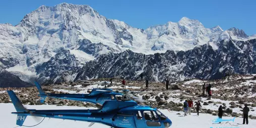Glacier Country Helicopters snow landing at Liebig Dome with passengers and Southern Alps backdrop