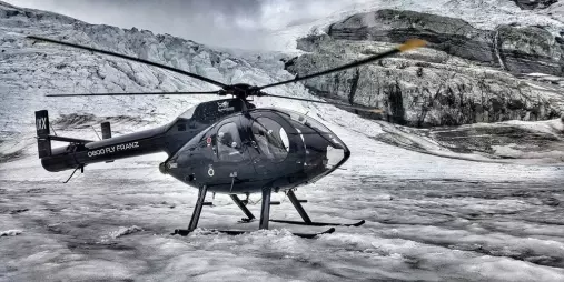 Helicopter parked on glacier during Mt Cook Supreme tour with Glacier Country Helicopters
