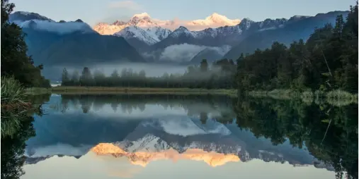 Sunrise reflection of Mount Cook and Mount Tasman on Lake Matheson