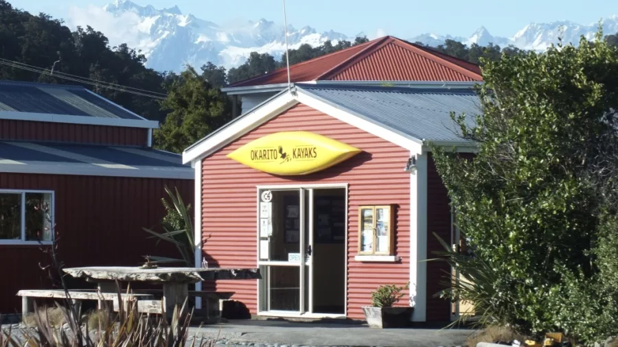 Okarito Kayaks base with Mount Cook and Southern Alps in the background on the West Coast