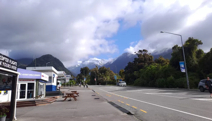 Franz Josef village main street with views of the Southern Alps on the West Coast
