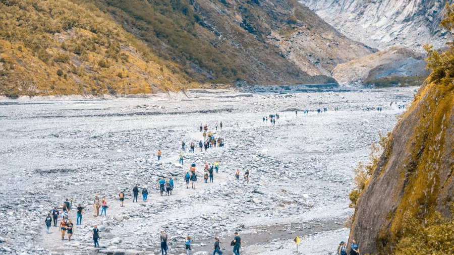 Visitors walking through the valley towards Franz Josef Glacier on the West Coast
