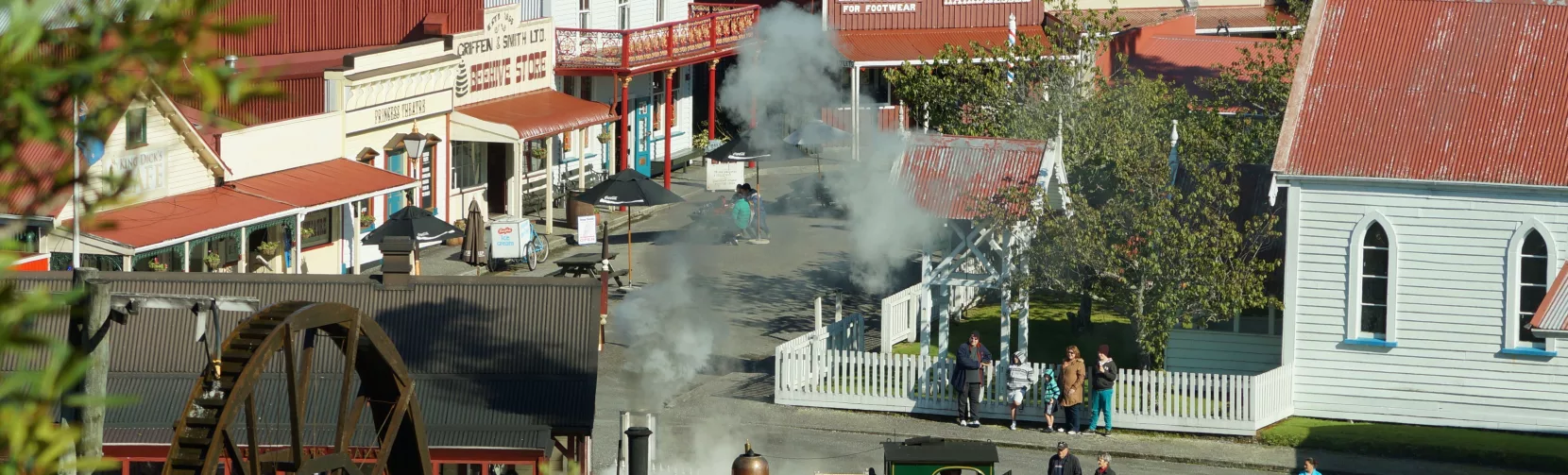 View of the heritage village and steam train at Shantytown Heritage Park near Greymouth on the West Coast of New Zealand.