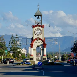 Historic Hokitika Clock Tower with Southern Alps in the background