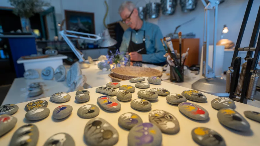 Hand-painted stone artworks on display at William Steyn’s studio in Hokitika on the West Coast
