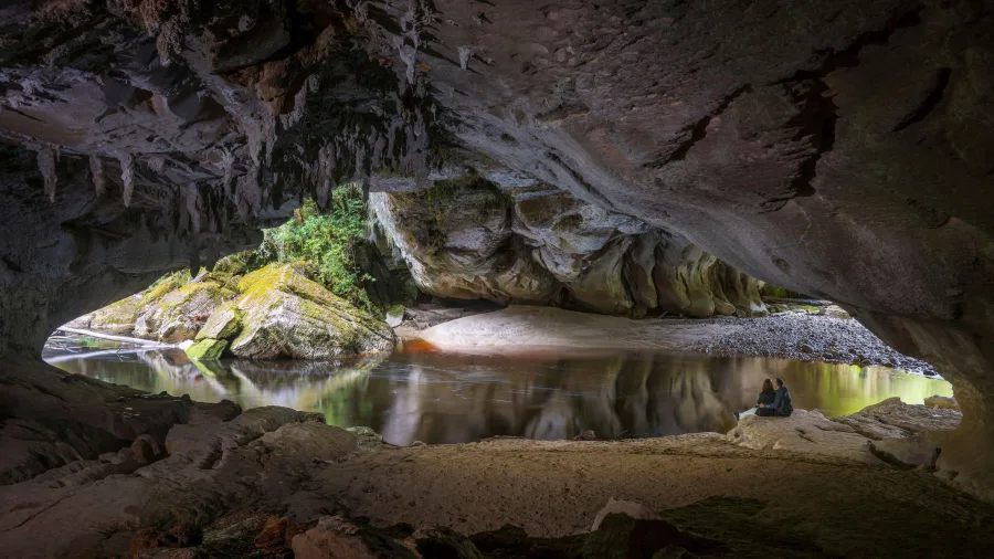 Reflections inside the cavernous Oparara Arch, West Coast