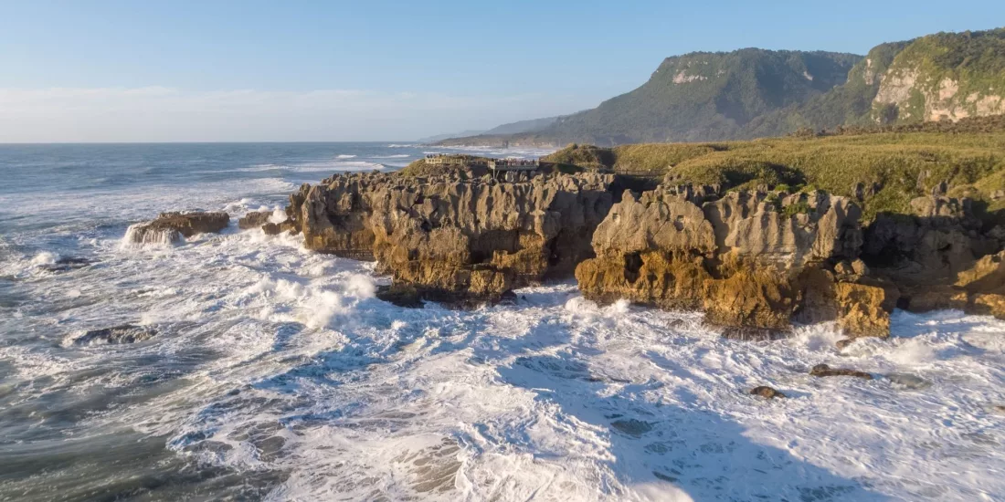 Aerial view of Punakaiki Pancake Rocks and crashing waves on the West Coast of New Zealand