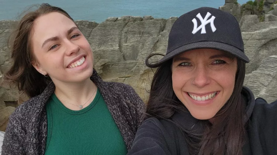 Two smiling women taking a selfie at Pancake Rocks in Punakaiki on the West Coast of New Zealand