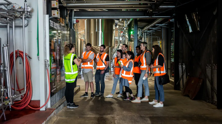 Brewery guide leading a group on a Monteith’s Brewery tour in Greymouth