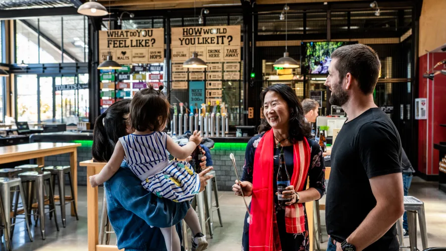 Visitors chatting in Monteith’s Brewery’s family-friendly bar area
