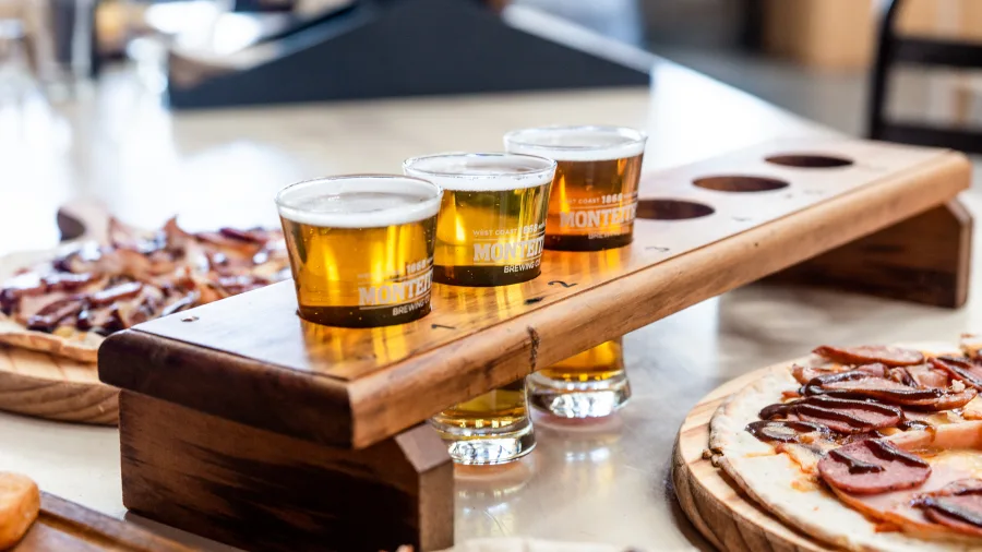 Beer tasting tray and pizzas at Monteith’s Brewery in Greymouth