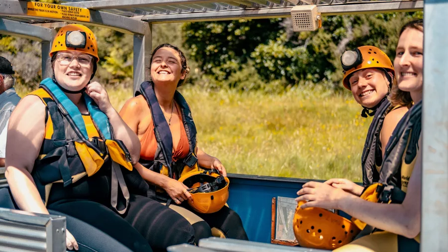 Smiling group on the Underworld Adventures rainforest train in Charleston